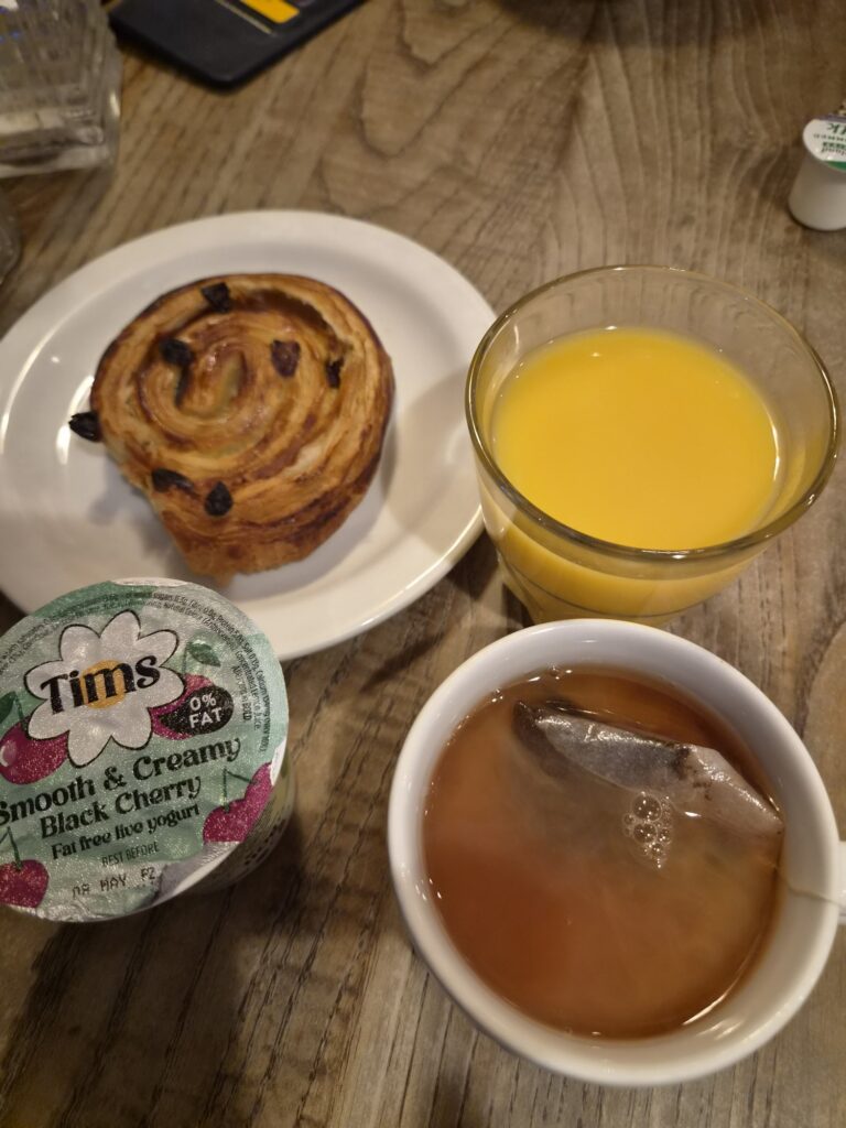 danish pastry, orange juice, yoghurt and tea