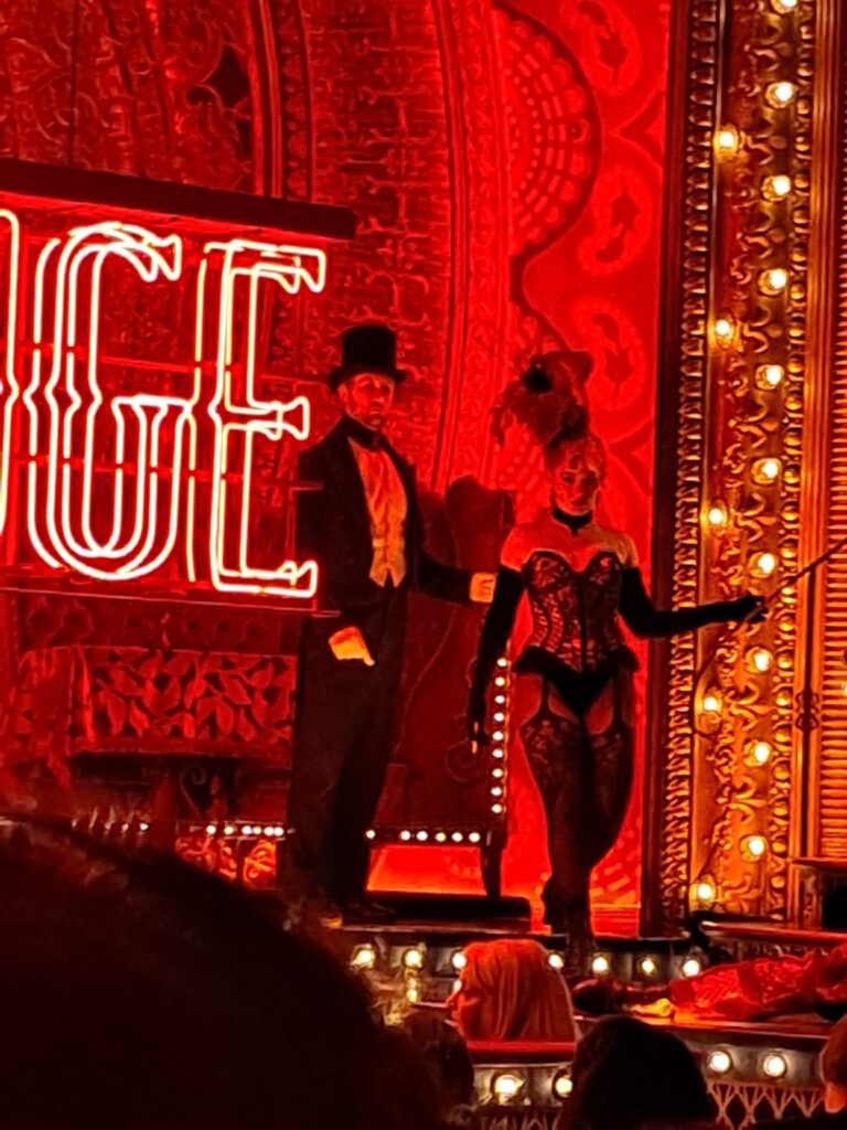 preshow actors on stage at moulin rouge