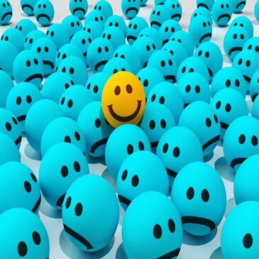 happy ball in a sea of sad balls