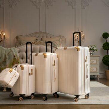 luggage- multiple cream suitcases on wheels